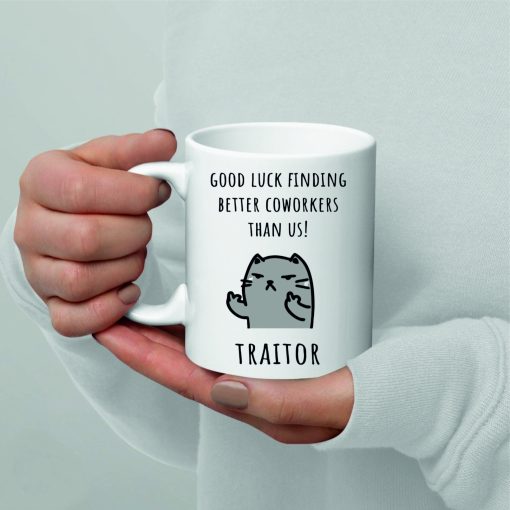 Printed mug gift with the caption "Good Luck Finding Better Coworkers Than Us! Traitor." The mug features bold typography and a humorous design.