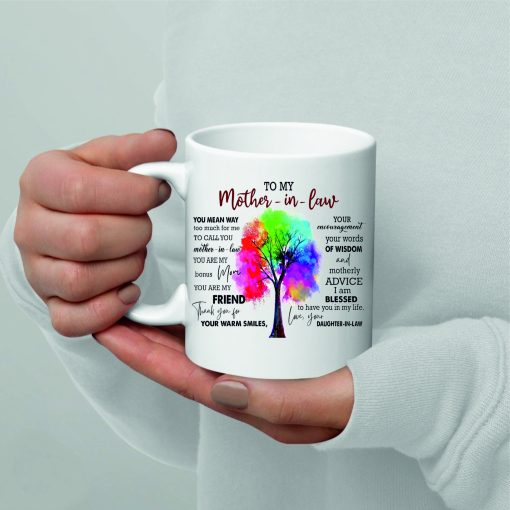 A white mug with a heartfelt message 'To My Mother-in-Law' written on it, surrounded by elegant designs.